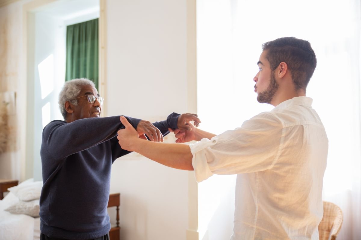 Support worker helping a client at home